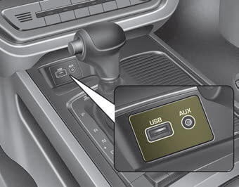 Kia Carnival: Aux, USB port. If your vehicle has an aux and/or USB(universal serial bus) port, you can use