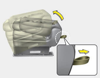 Kia Carnival: Rear seat adjustment. 6. Pull the removal strap and lift the rear portion of the seat cushion.