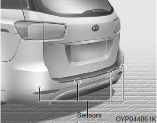 Kia Carnival: Rear parking assist system. The rear parking assist system assists the driver during backward movement of